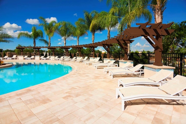 view of swimming pool featuring a pergola and a patio