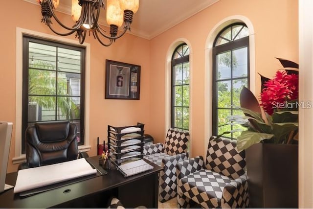 sitting room with a notable chandelier and ornamental molding