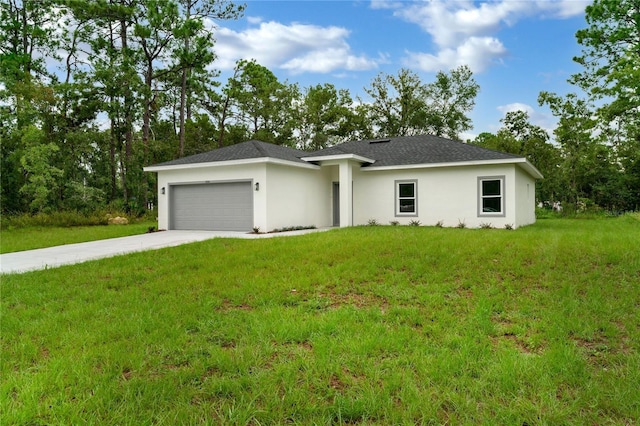 single story home with a garage and a front lawn