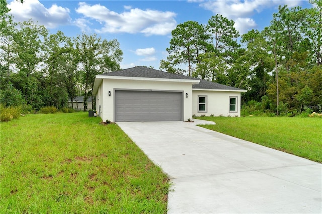 view of front facade with a front yard and a garage