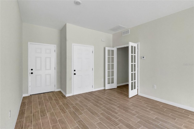 unfurnished bedroom featuring hardwood / wood-style floors and a closet