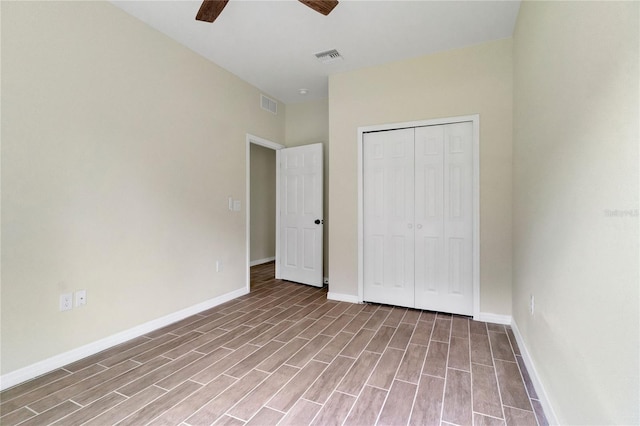 unfurnished bedroom featuring light hardwood / wood-style flooring, ceiling fan, and a closet