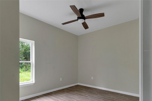 unfurnished room featuring ceiling fan and hardwood / wood-style flooring