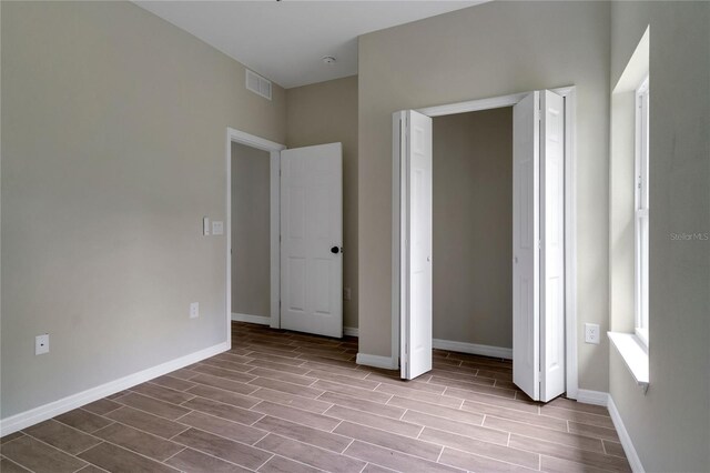 unfurnished bedroom featuring a closet