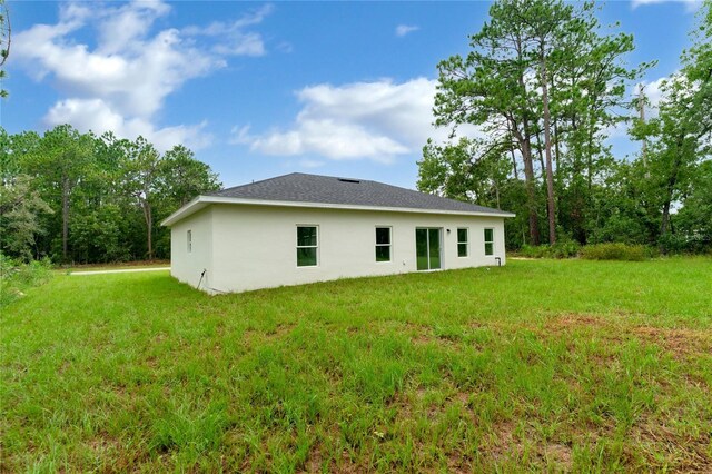 view of property exterior with a lawn