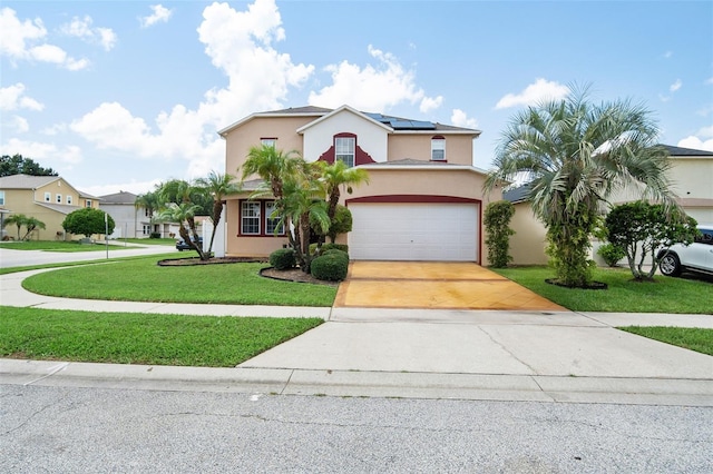 view of front facade featuring a garage and a front yard