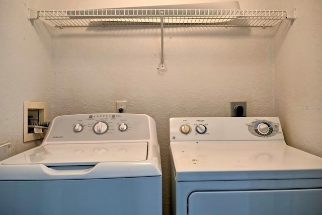 washroom with washer and dryer