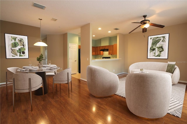 interior space featuring ceiling fan and dark hardwood / wood-style flooring