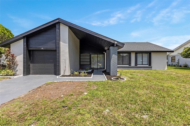 mid-century inspired home featuring brick siding, stucco siding, concrete driveway, an attached garage, and a front lawn