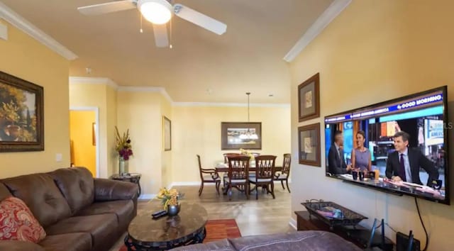 living room featuring ceiling fan, light tile patterned floors, and crown molding