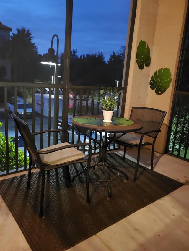 view of balcony at dusk