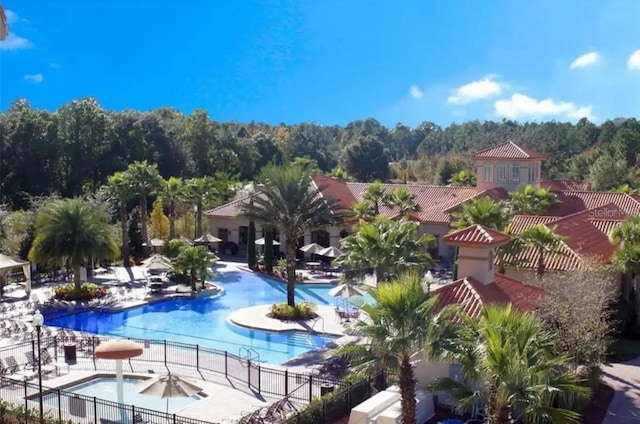 view of swimming pool with a patio