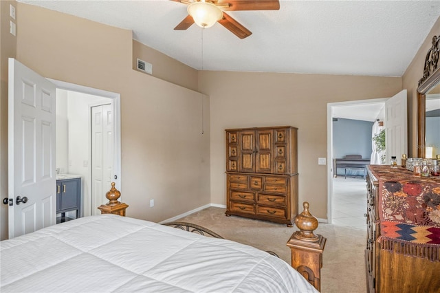 bedroom featuring vaulted ceiling, baseboards, visible vents, and light colored carpet