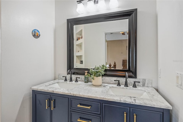 bathroom with double vanity and a sink