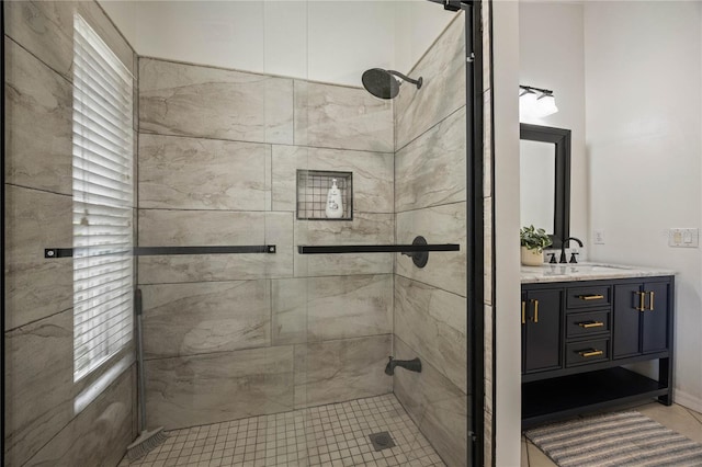 bathroom with a stall shower and vanity