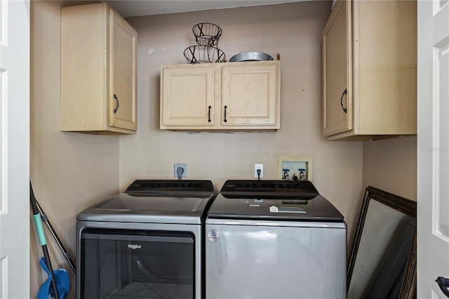 laundry room featuring cabinet space and independent washer and dryer