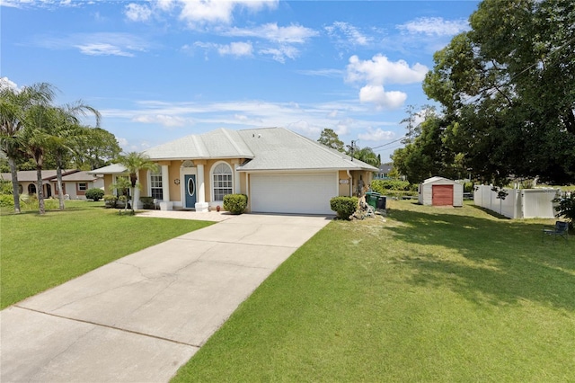 ranch-style house with a shed, a garage, fence, concrete driveway, and a front lawn