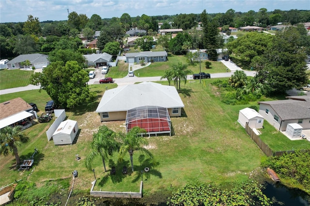 birds eye view of property with a residential view