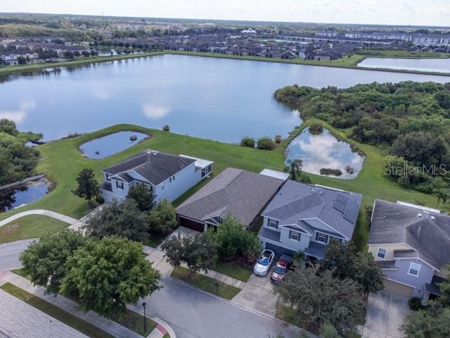 birds eye view of property featuring a water view