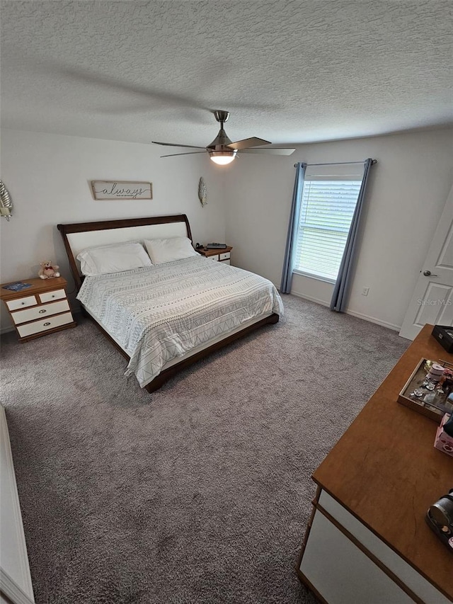 unfurnished bedroom featuring a textured ceiling, carpet flooring, and ceiling fan