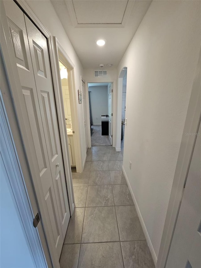 hallway with light tile patterned flooring