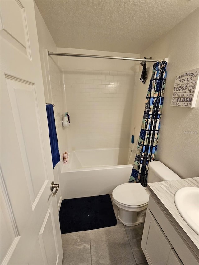 full bathroom featuring toilet, vanity, tile patterned floors, a textured ceiling, and shower / bathtub combination with curtain