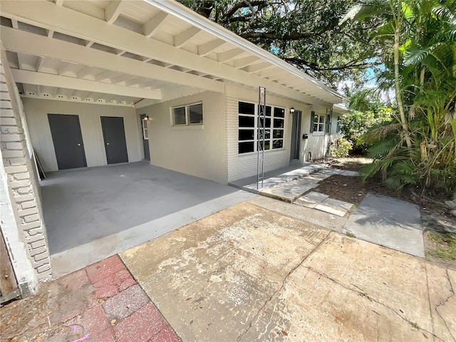 view of patio / terrace featuring a carport