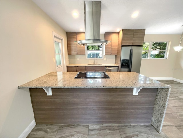 kitchen with sink, stainless steel appliances, island exhaust hood, and kitchen peninsula