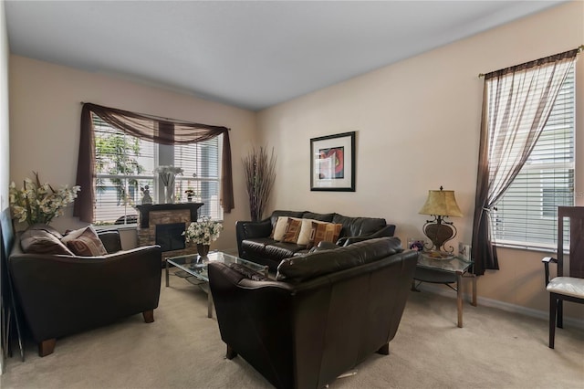 living room featuring light colored carpet and a fireplace