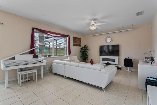 living room with ceiling fan and light tile patterned floors