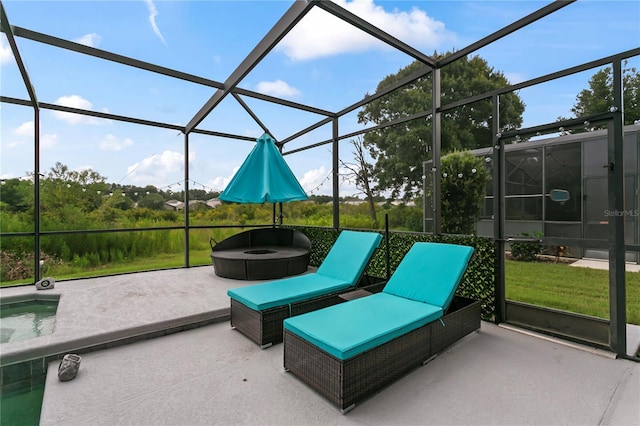 view of patio featuring glass enclosure