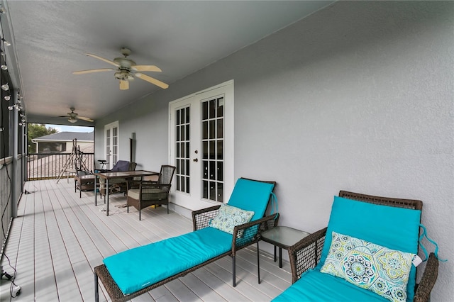 wooden terrace with ceiling fan and french doors