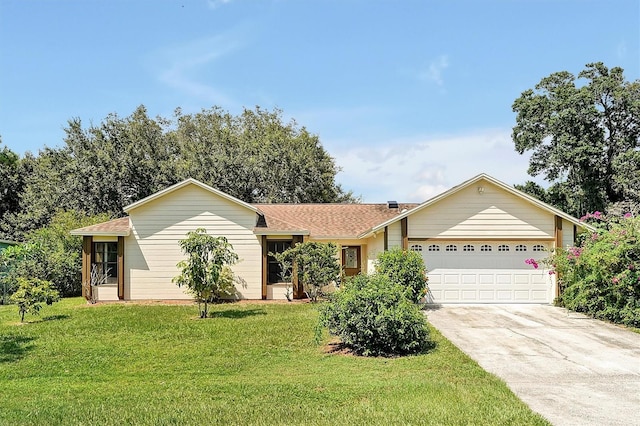 ranch-style home featuring a front yard and a garage