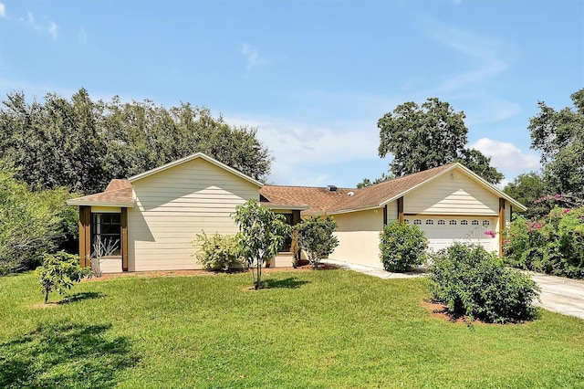 single story home with a garage, concrete driveway, and a front yard