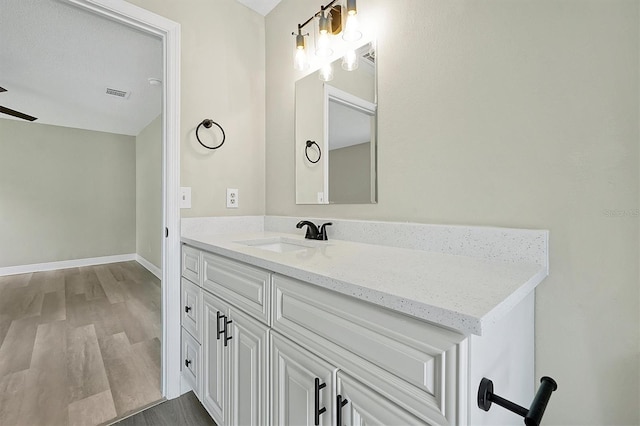 bathroom featuring vanity and hardwood / wood-style floors