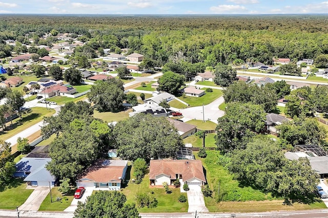 aerial view featuring a residential view and a forest view