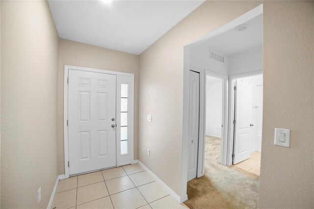 view of carpeted entrance foyer