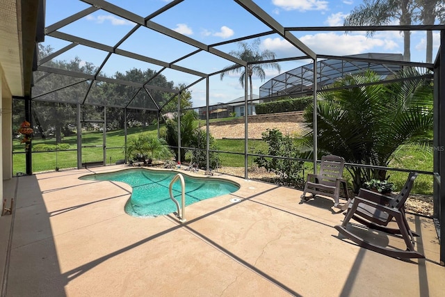 view of pool featuring a patio and a lanai