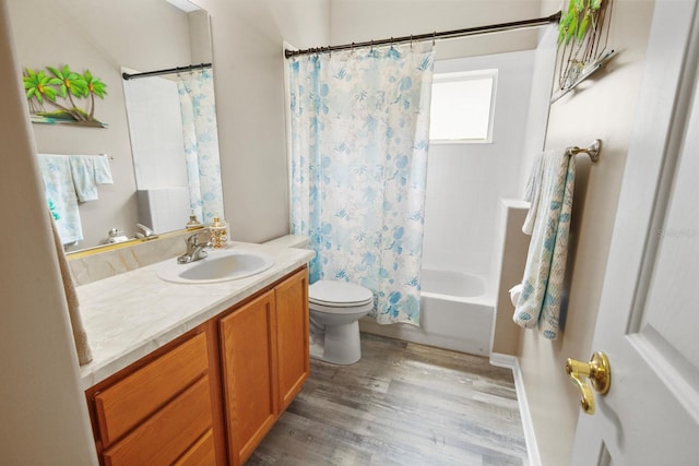 full bathroom with toilet, vanity, shower / tub combo with curtain, and wood-type flooring