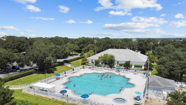 view of swimming pool with a yard and a patio