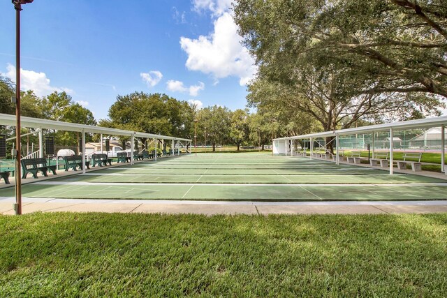 view of property's community featuring shuffleboard