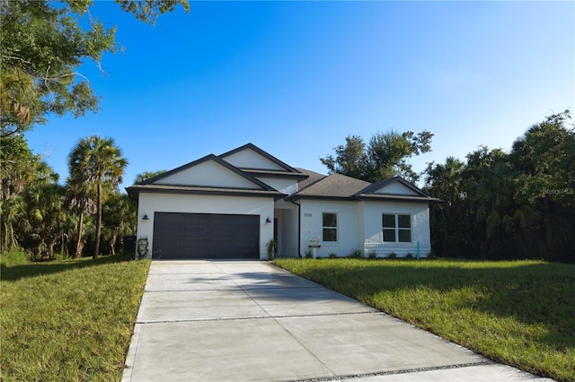 single story home featuring a front yard and a garage