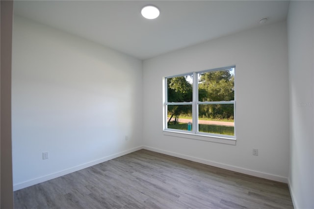 empty room featuring hardwood / wood-style flooring