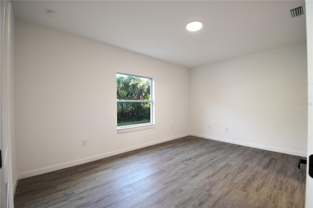 unfurnished room featuring hardwood / wood-style floors