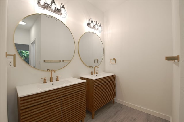 bathroom featuring wood-type flooring and vanity