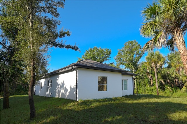 view of home's exterior featuring a lawn