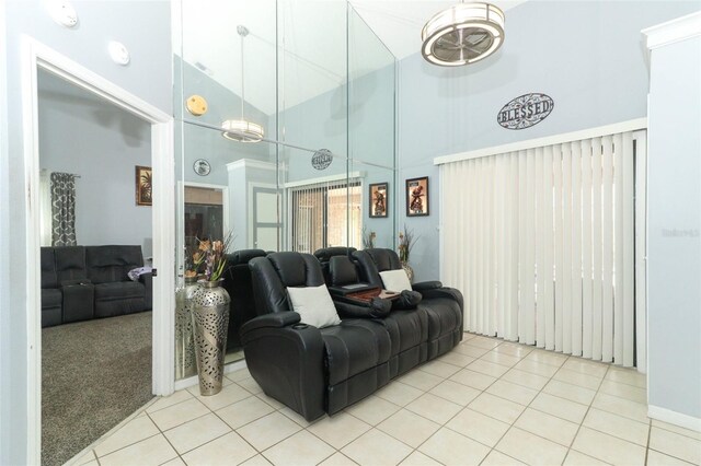 living room featuring tile patterned floors and high vaulted ceiling