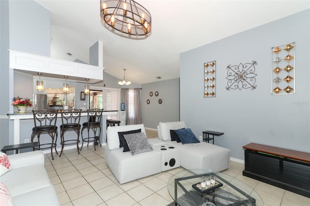 tiled living room with high vaulted ceiling and a chandelier