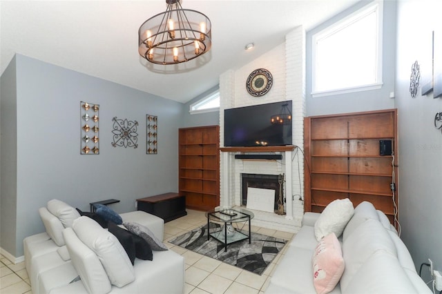 living room featuring a chandelier, brick wall, a brick fireplace, vaulted ceiling, and light tile patterned floors