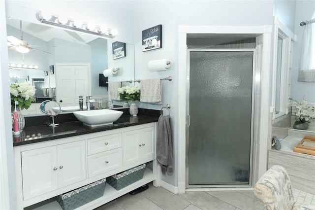 bathroom featuring tile patterned flooring, ceiling fan, vanity, and walk in shower